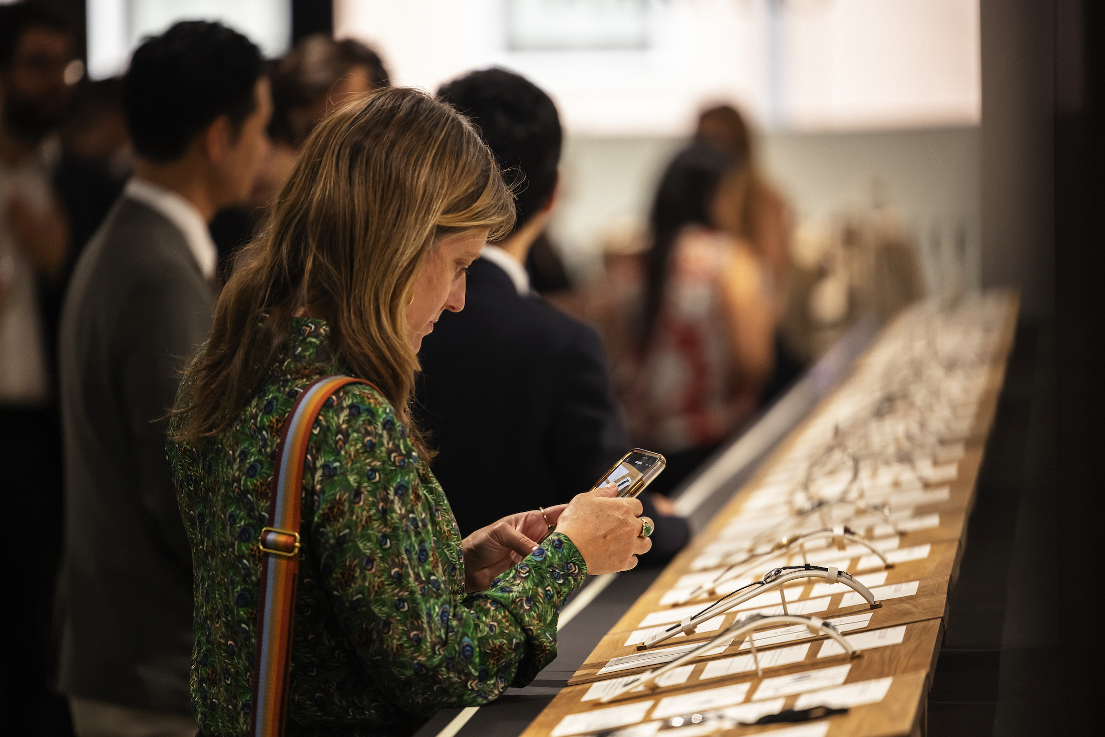 A woman looking at watches