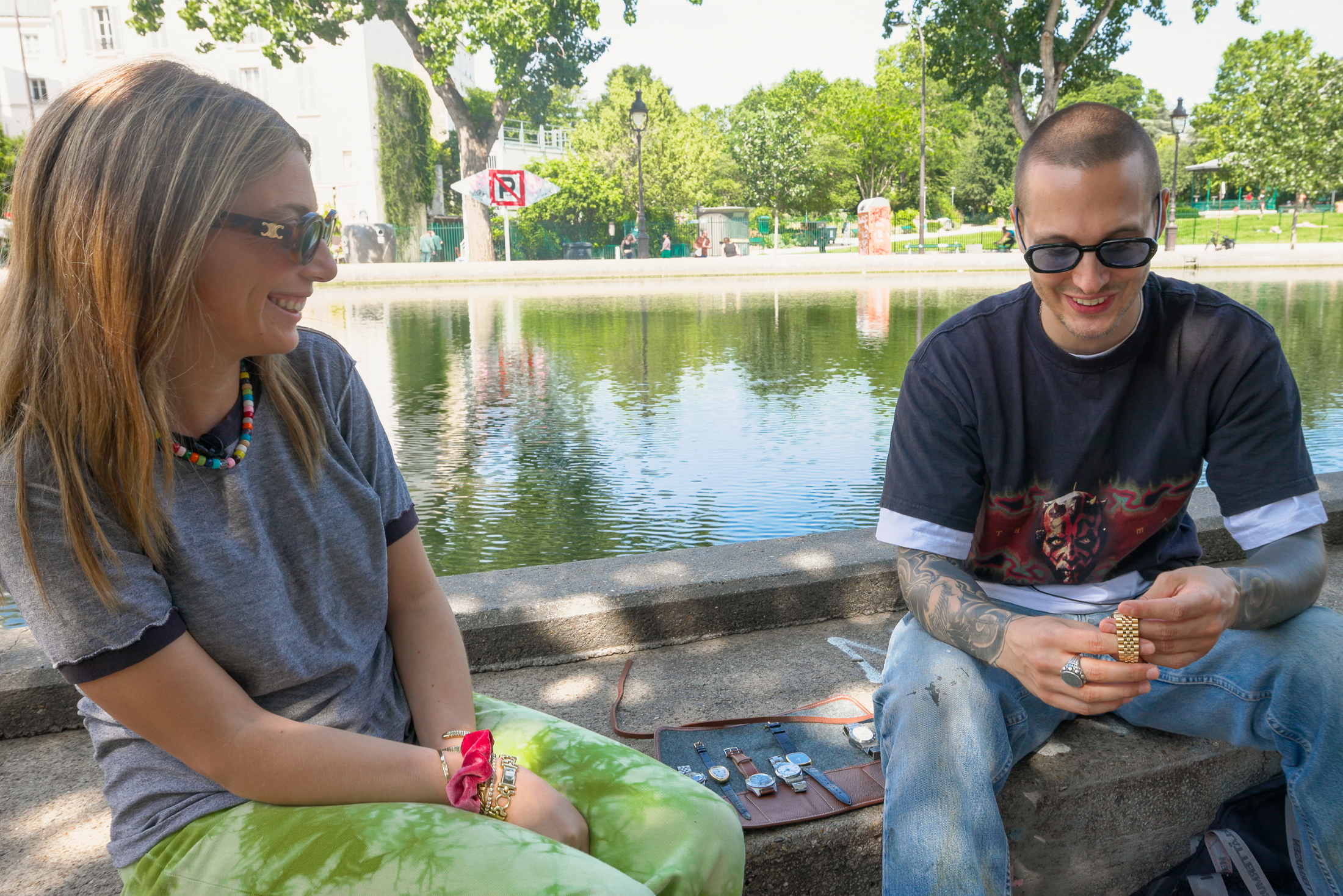 Malaika (left) smiles while discussing the watch collection of her friend Julien (right)