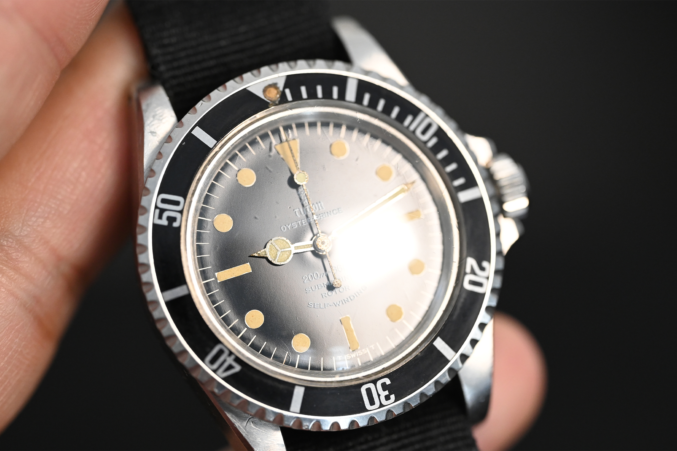 A Tudor Submariner with gloss dial