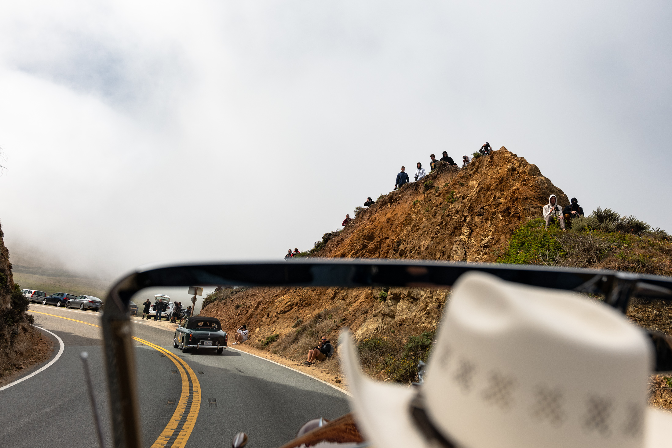 crowds line the hills.