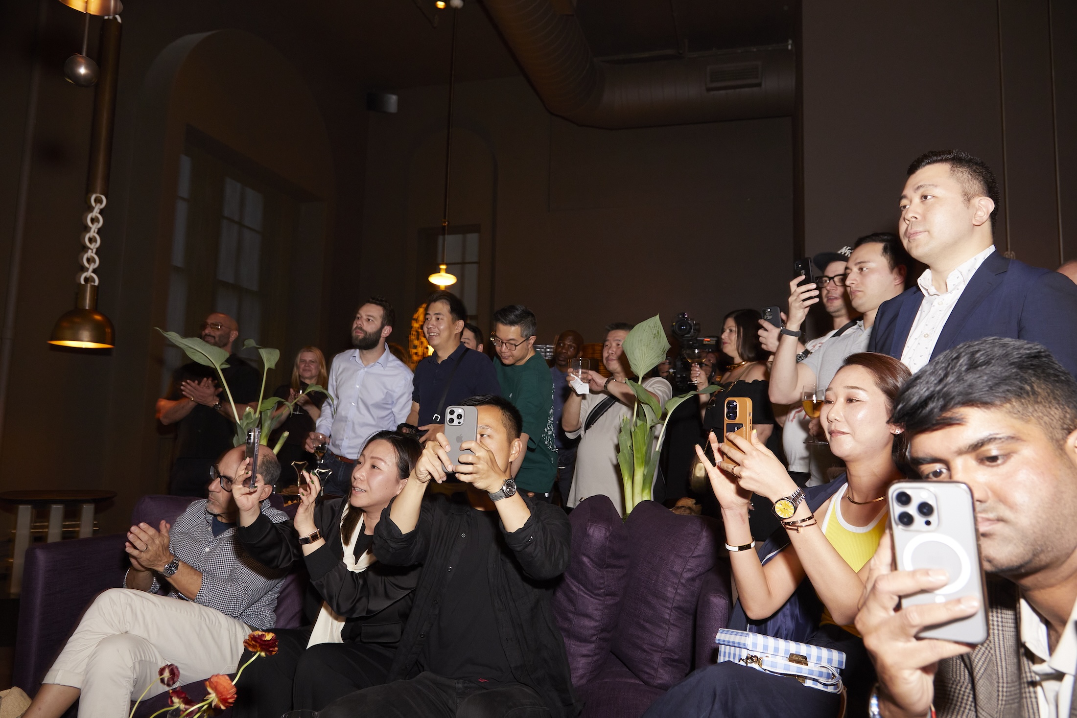 A group of people watching an unveiling