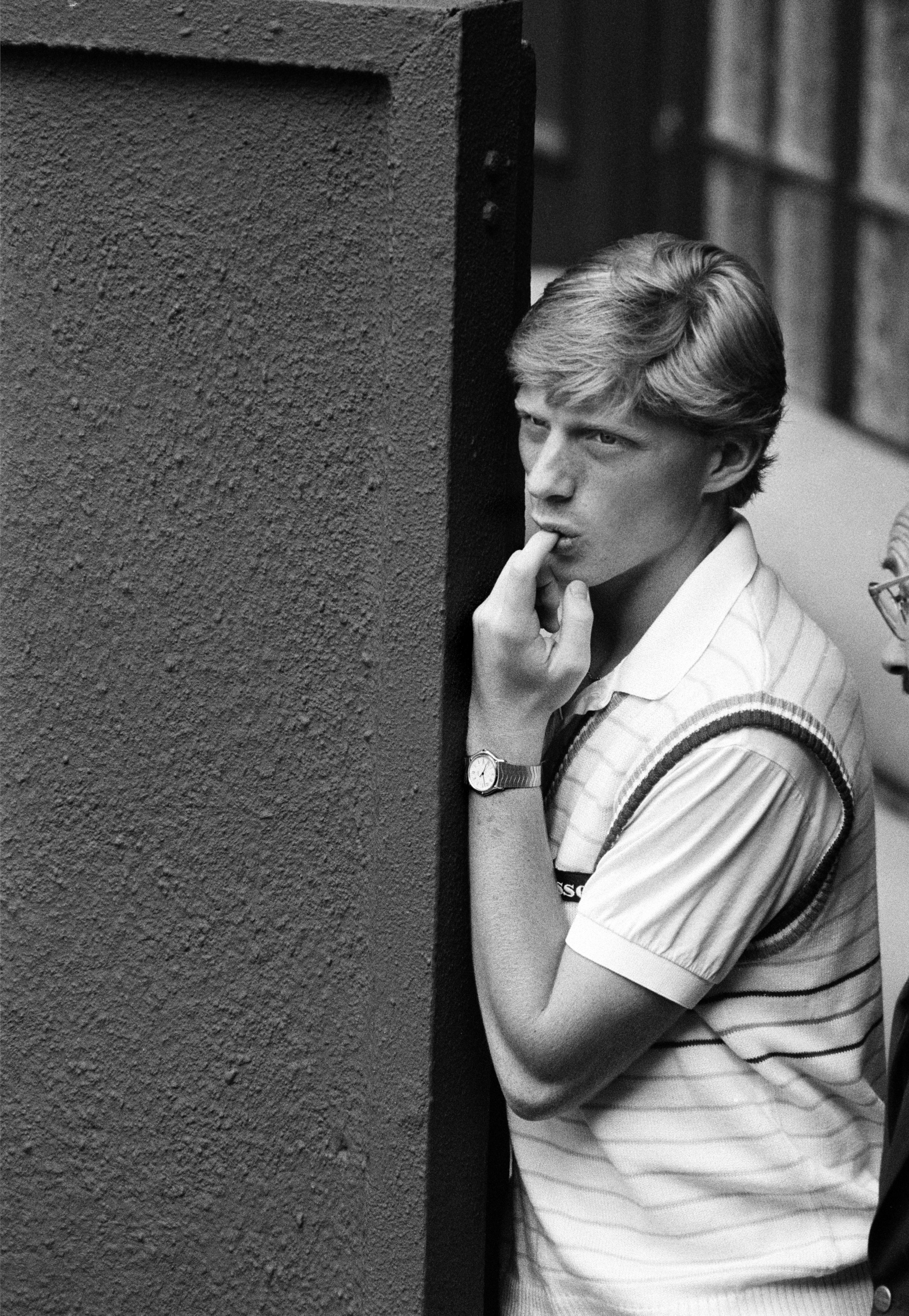 17-year-old Boris Becker watches a match from the sidelines of the centre court at Wimbledon, June 1985