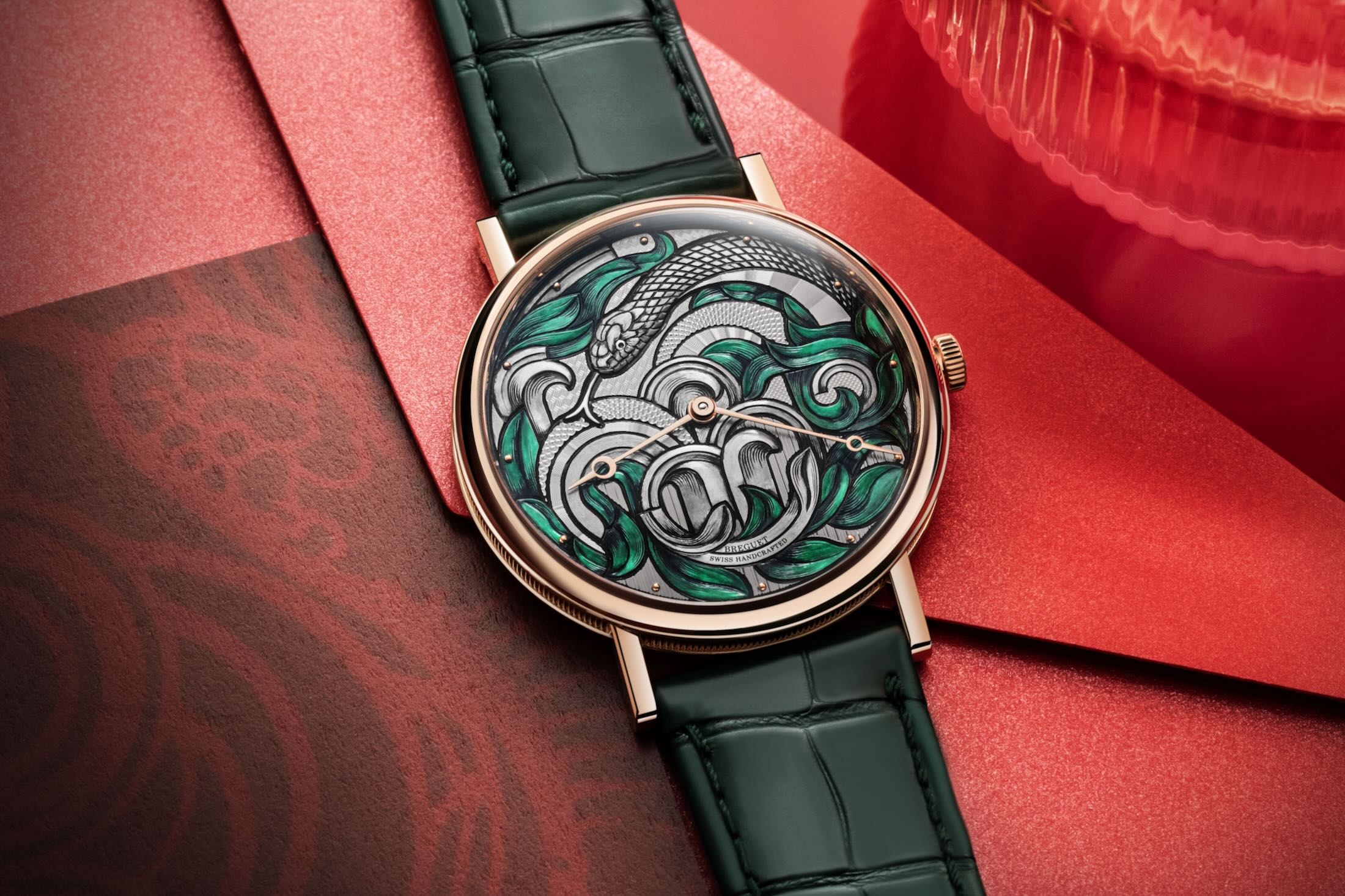 breguet snake edition laid out on red
