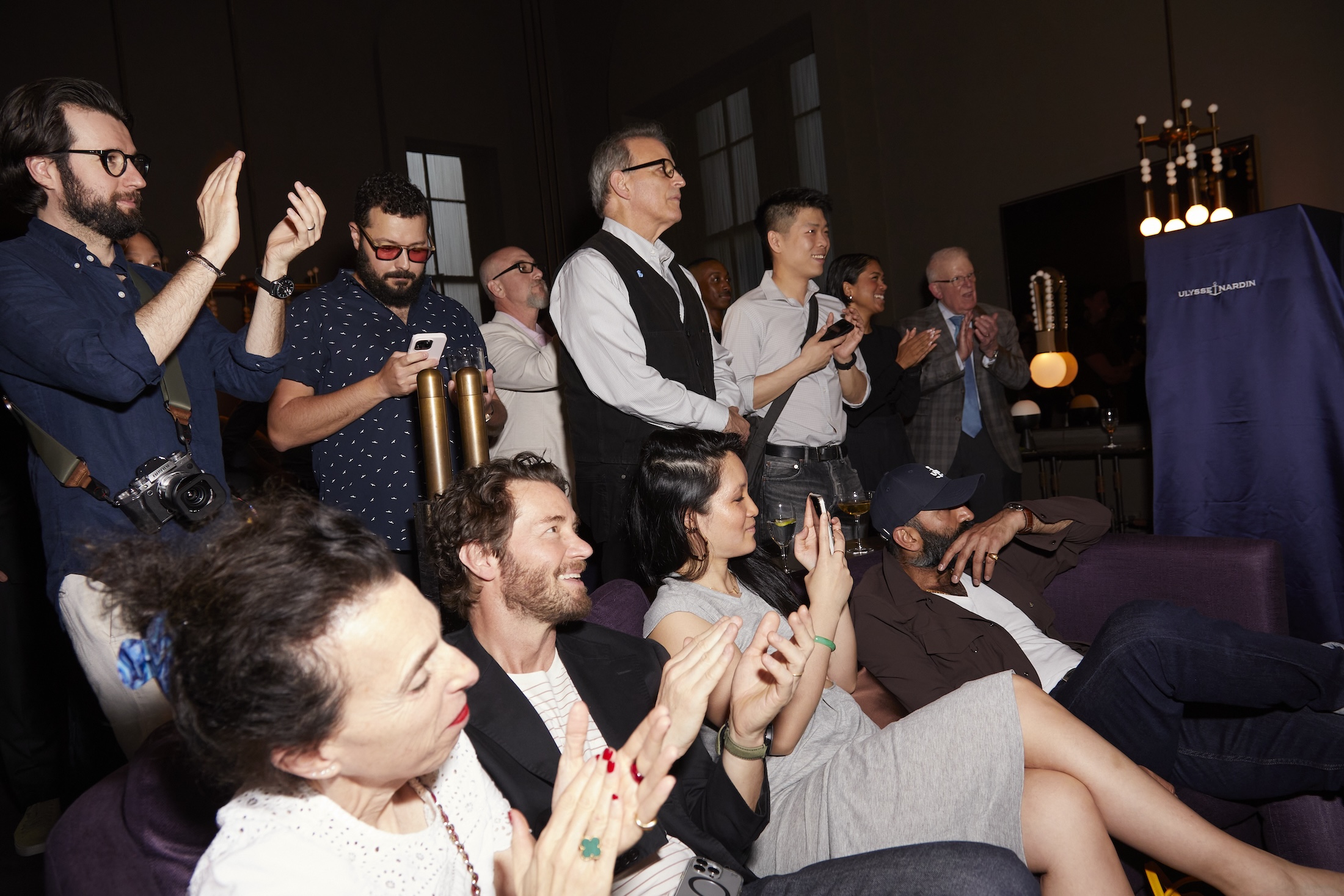 A group of people watching an unveiling